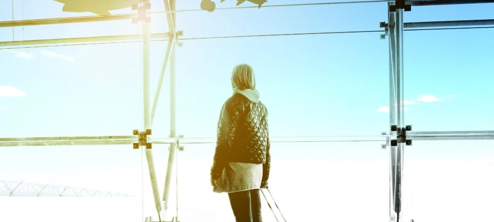 woman looking out Southwest Reservations